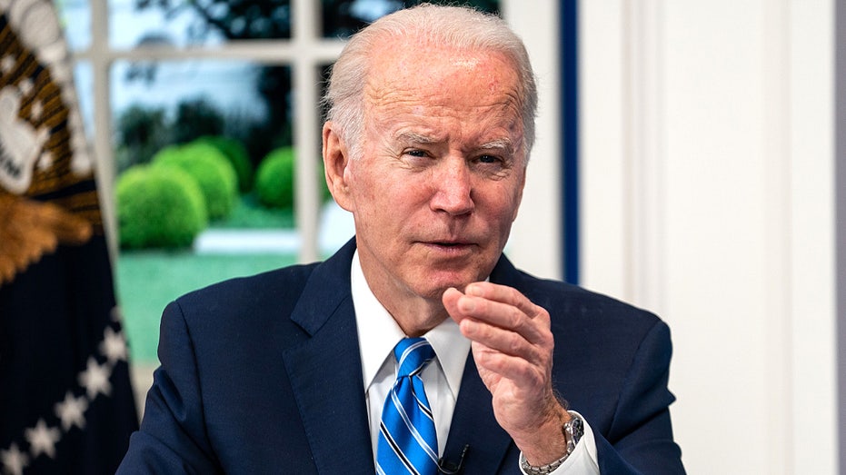 WASHINGTON, DC - DECEMBER 27: President Joe Biden and the White House COVID-19 Response Team participate in a virtual call with the National Governors Association from the South Court Auditorium of the Eisenhower Executive Office Building of the White House Complex on Monday, Dec. 27, 2021 in Washington, DC. President Biden spoke to governors about their concerns regarding the Omicron variant of the Coronavirus and the need for more COVID-19 tests. (Kent Nishimura / Los Angeles Times via Getty Images)