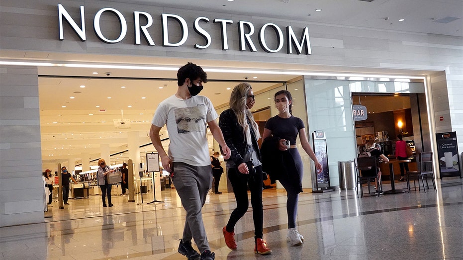 Shoppers leave a Nordstrom store on May 26, 2021, in Chicago. 