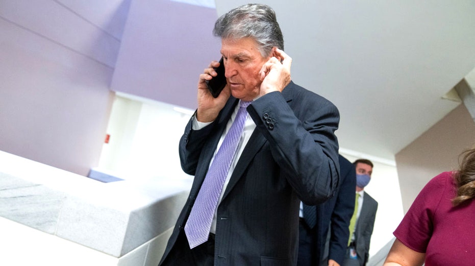 Sen. Joe Manchin, D-W.Va., arrives for a Senate Energy and Natural Resources Committee markup in Dirksen Building, Nov. 18, 2021.