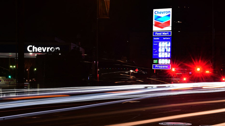 Traffic passes a downtown Los Angeles gas station where a gallon of gas costs over $6 on Dec. 10, 2021. 