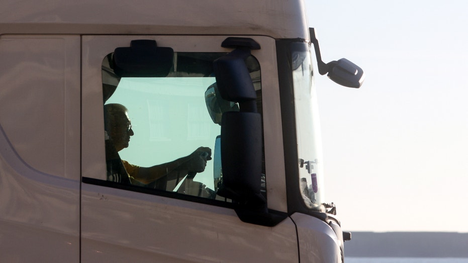 A driver inside a haulage truck as it leaves the Port of Dover Ltd. in Dover, U.K., on Tuesday, Dec. 21, 2021. Covid-19 and Brexit have created a 