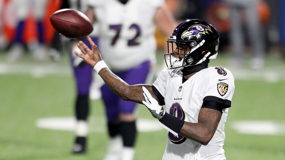 Lamar Jackson of the Baltimore Ravens passes during the second quarter of an AFC Divisional Playoff game against the Buffalo Bills at Bills Stadium on Jan. 16, 2021, in Orchard Park, New York.