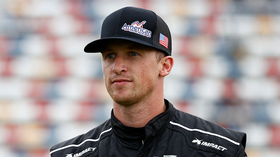 CONCORD, NORTH CAROLINA - OCTOBER 09: Brandon Brown, driver of the #68 American PetroLog Chevrolet, walks the grid prior to the NASCAR Xfinity Series Drive for the Cure 250 presented by Blue Cross Blue Shield of North Carolina at Charlotte Motor Speedway on October 09, 2021 in Concord, North Carolina. (Photo by Jared C. Tilton/Getty Images)