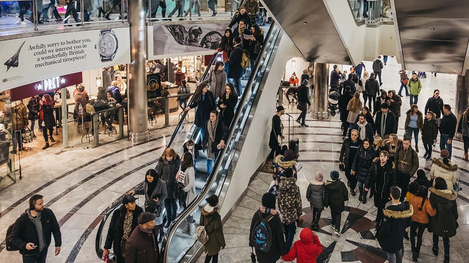 People inside One Canada Square Mall in Canary Wharf, London, UK.