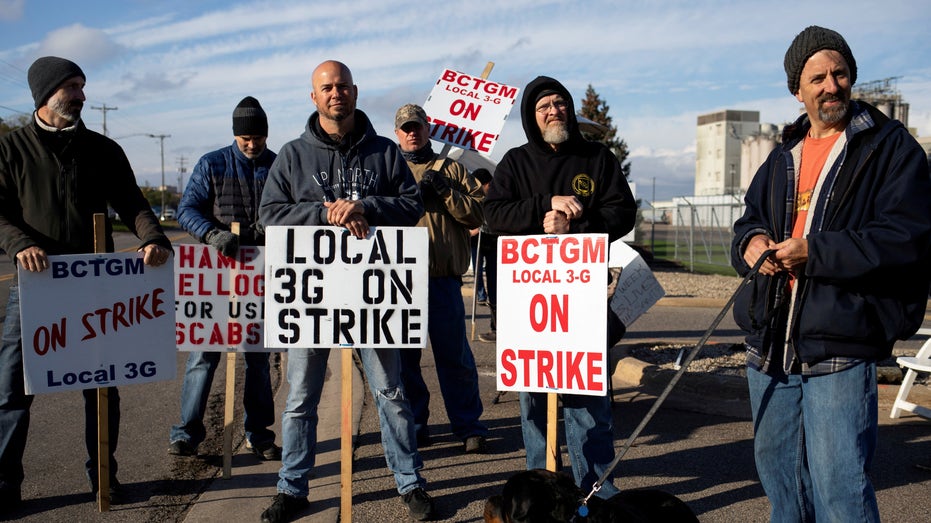 A group of union workers from Kellogg's picket outside the cereal maker's headquarters as they remain on strike in Battle Creek, Michigan, on Oct. 21, 2021. 