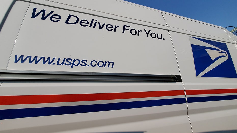 Wide-angle view of United States Postal Service (USPS) truck with logo visible, Lafayette, California, Sep. 17, 2020. 