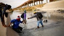 FILE PHOTO: Asylum-seeking migrants from Haiti cross the Rio Bravo river to turn themselves in to U.S Border Patrol agents. REUTERS/Jose Luis Gonzalez/File Photo