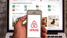 SPAIN - 2021/04/15: In this photo illustration, the Airbnb app seen displayed on a smartphone screen with the Airbnb website displayed on a laptop in the background. (Photo Illustration by Thiago Prudencio/SOPA Images/LightRocket via Getty Images)