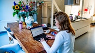 Remote work boosts productivity and helps fight inflation despite business leaders doubts