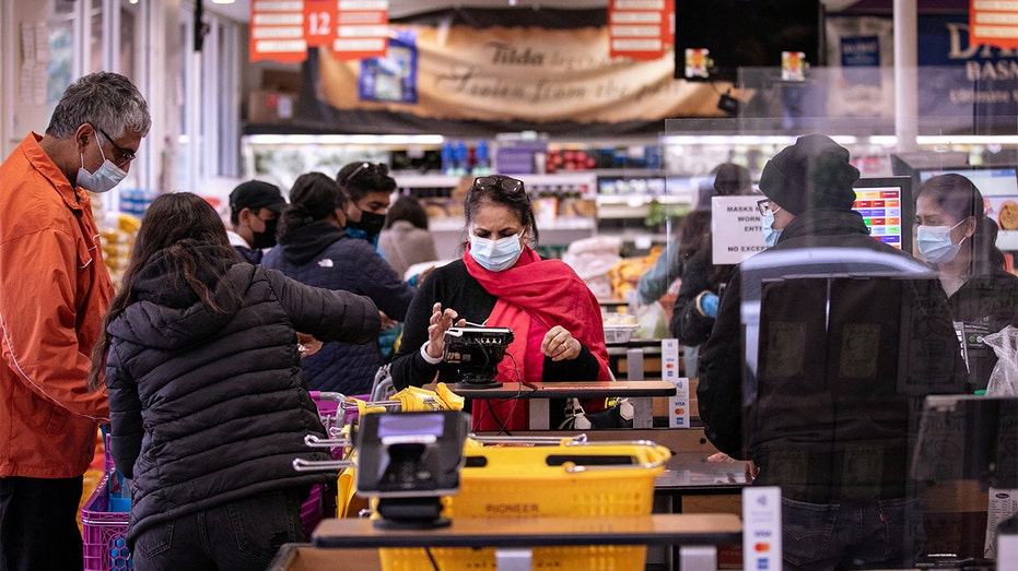 People shop in the original Pioneer Cash & Carry in Little India, Dec. 28, 2021, in Artesia, California. 