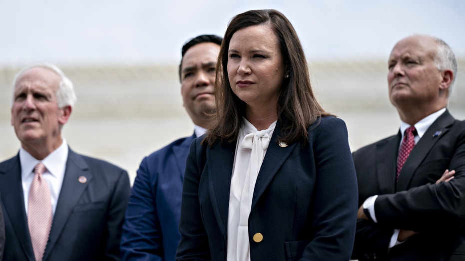 Doug Peterson, Nebraska attorney general, from right, Ashley Moody, Florida attorney general, Sean Reyes, Utah attorney general, and Herbert Slatery III, Tennessee attorney general, listen during a news conference outside the Supreme Court in Washington, D.C., U.S., on Monday, Sept. 9, 2019. A group of 50 attorneys general opened a broad investigation into whether advertising practices of Alphabet Inc.'s Google violate antitrust laws. Photographer: Andrew Harrer/Bloomberg