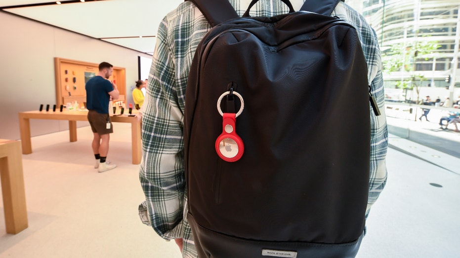 A key ring containing an AirTag attached to a rucksack inside the Apple Store George Street on April 30, 2021 in Sydney, Australia. Apple's latest accessory, the AirTag is a small device that helps people keep track of belongings, using Apple's Find My network to locate lost items like keys, wallet, or a bag. (Photo by James D. Morgan/Getty Images)