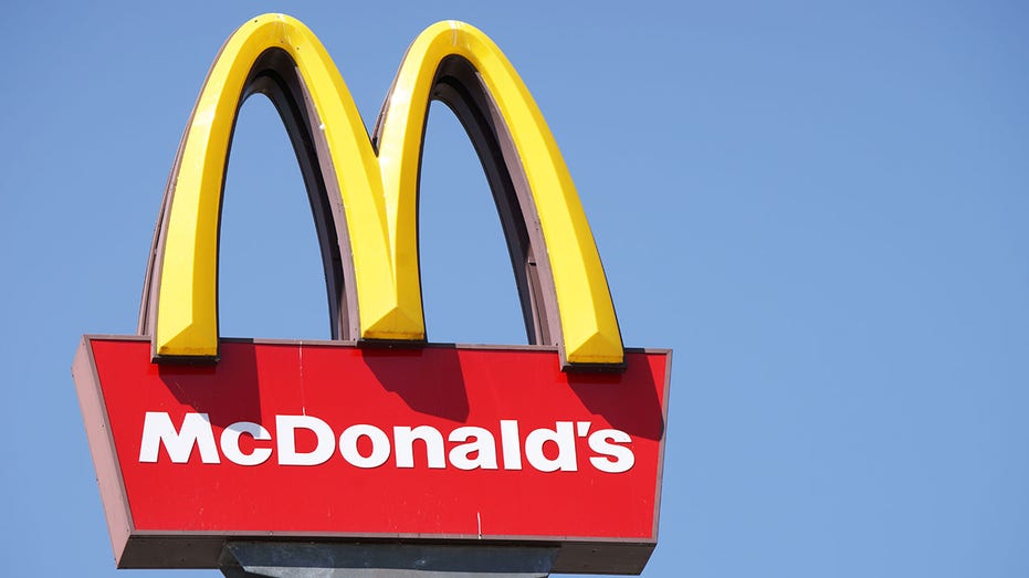 Close-up McDonalds outdoor sign against blue sky