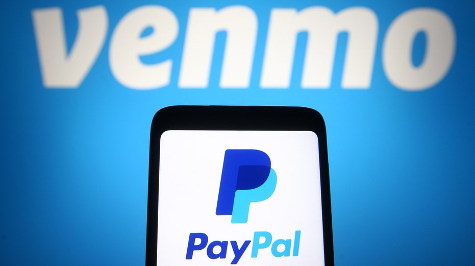 PayPal logo on a smartphone screen in front of Venmo logo.