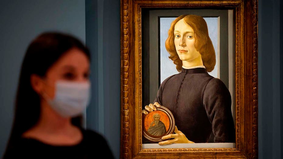 Young Man Holding a Roundel Botticelli