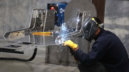 A worker welds a custom built aluminum body frame for a Venice roadster model vehicle at the Vanderhall Motor Works Inc. manufacturing facility in Provo, Utah, U.S., on Tuesday, Sept. 25, 2018. The U.S. Census Bureau is scheduled to release durable goods orders on October 4. Photographer: George Frey/Bloomberg via Getty Images - Fox Business News