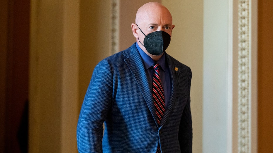 Senator Mark Kelly, a Democrat from Arizona, walks through the U.S. Capitol in Washington, D.C., U.S., on Tuesday, Aug. 10, 2021. The Senate passed a $550 billion infrastructure plan that would represent the biggest burst of spending on U.S. public works in decades and notch a significant victory for President Biden's economic agenda. Photographer: Amanda Andrade-Rhoades/Bloomberg