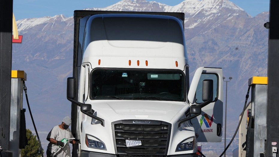 A trucker fuels up at the Love's Truck Stop in Springville, Utah, on December 1, 2021. - High fuel prices and a shortage of truckers have had a negative effect on the US supply chain. The US economy continues to struggle with supply issues that have pushed prices higher in recent weeks, but there are signs the strains may be easing, the Federal Reserve said on December 1. (Photo by GEORGE FREY/AFP via Getty Images)