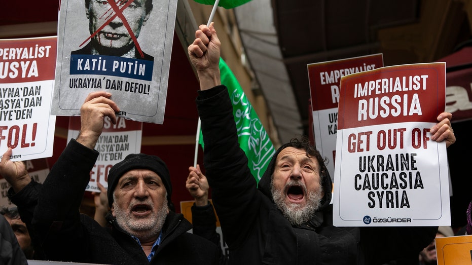 People protest against Russia’s invasion of Ukraine outside the Russian Consulate on Feb. 24, 2022, in Istanbul, Turkey.