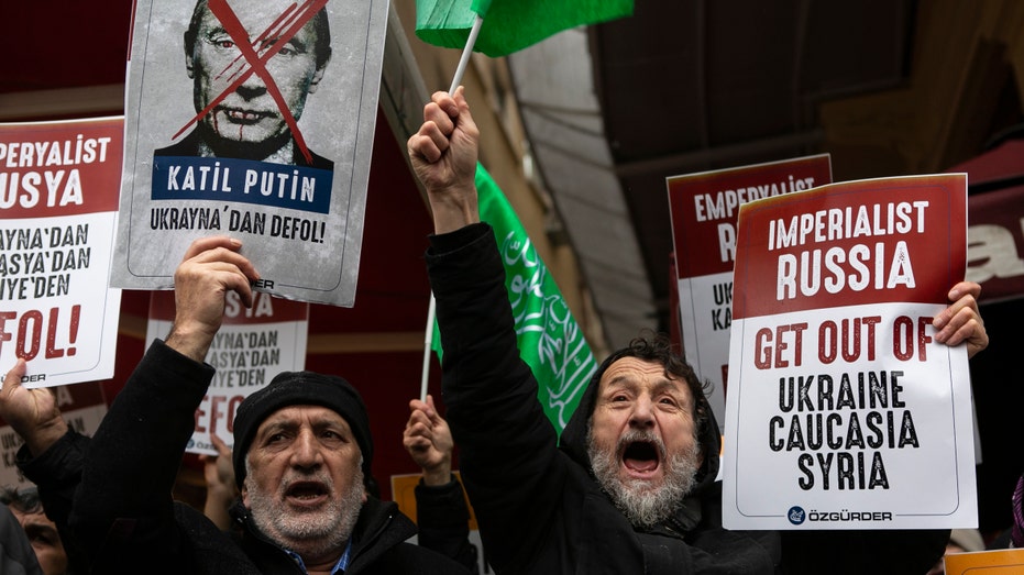 People protest against Russia’s invasion of Ukraine outside the Russian Consulate on Feb. 24, 2022, in Istanbul, Turkey.