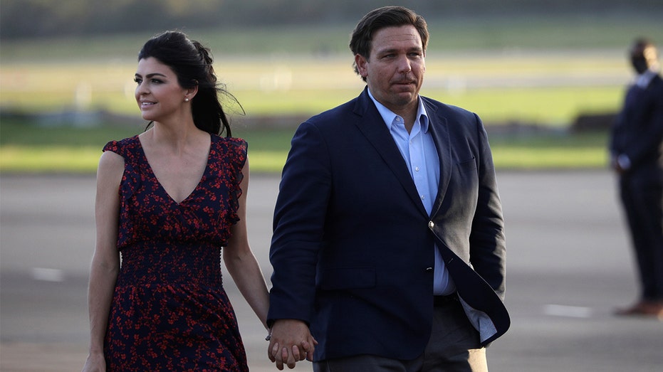 Florida Gov. Ron DeSantis and his wife Casey DeSantis walk at Ocala International Airport