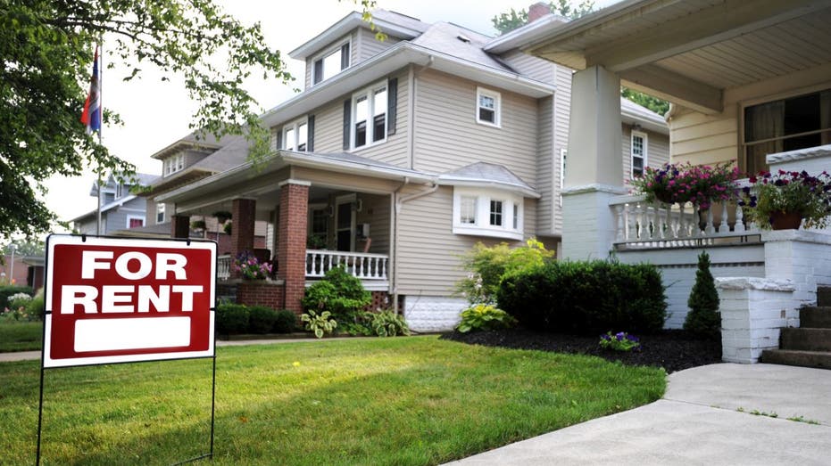 House with 'For Rent' sign