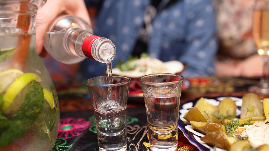 Person pouring vodka