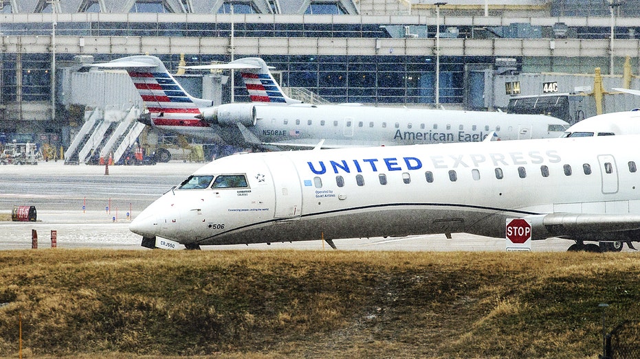 United Airlines and American Airlines aircraft on the DC runway