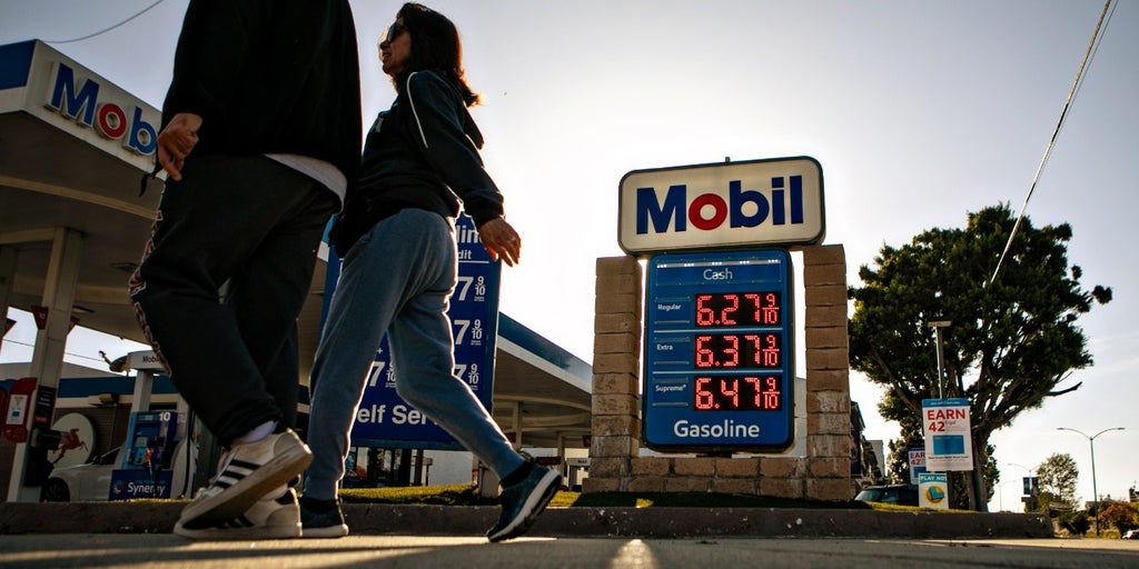 people-walking-gas-station-prices-inflat