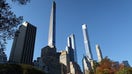 NEW YORK, NY - NOVEMBER 9: The Steinway Tower and Central Park Tower on Billionaires&apos; Row rise above fall foliage in Central Park on November 9, 2021, in New York City. 