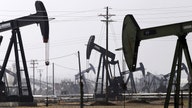 Oil prices trade higher, head for weekly decline