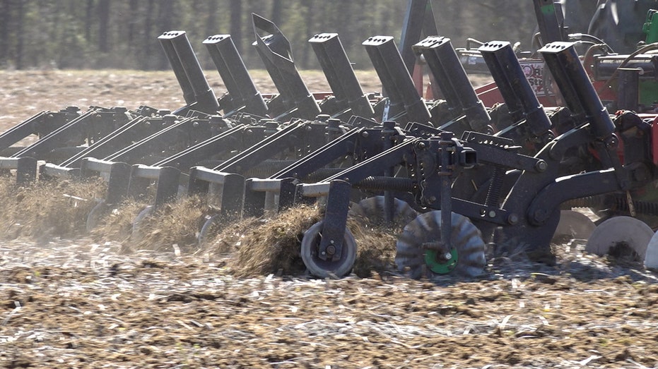 Farmers and tractors at work