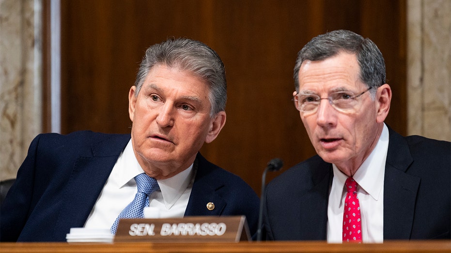 Chairman Sen. Joe Manchin, D-W. Va., left, and ranking member Sen. John Barrasso, R-Wyo., talk before the start of the Senate Energy and Natural Resources Committee hearing on Thursday, March 3, 2022, on natural gas pipelines. (Bill Clark/CQ-Roll Call, Inc via Getty Images)