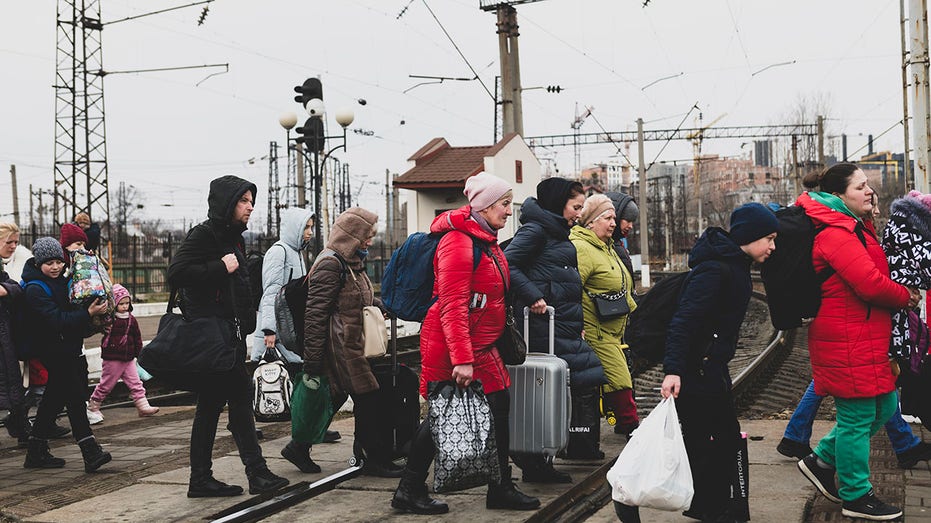 Ukrainians arriving at the train station in Lviv, Ukraine