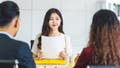 Young woman graduate holding the resume document and preparing to two manager before start to job interview with positive motion in meeting room,Business Hiring new member concept
