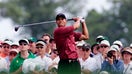 Tiger Woods of the United States tees off on the eighth hole with the gallery crowded behind during the final round of play at the Masters at the Augusta National Golf Club April 8, 2001. Woods began the round as the tournament leader with a 12-under-par total of 204.

JLS/RCS