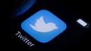 BERLIN, GERMANY - MARCH 10: In this photo illustration the logo of Twitter can be seen on a smartphone on March 10, 2022 in Berlin, Germany. (Photo Illustration by Thomas Trutschel/Photothek via Getty Images)