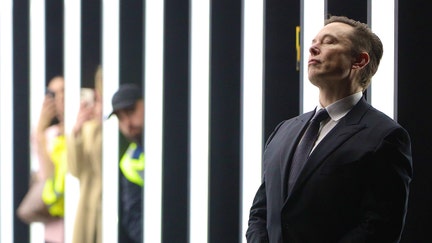GRUENHEIDE, GERMANY - MARCH 22: (Alternate crop of #1239417601) Tesla CEO Elon Musk contemplates during the official opening of the new Tesla electric car manufacturing plant on March 22, 2022 near Gruenheide, Germany. The new plant, officially called the Gigafactory Berlin-Brandenburg, is producing the Model Y as well as electric car batteries. 