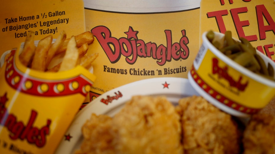 Bojangles chicken and biscuits seen on a placemat.