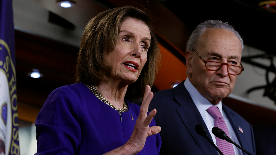 Nancy Pelosi and Chuck Schumer at a press conference