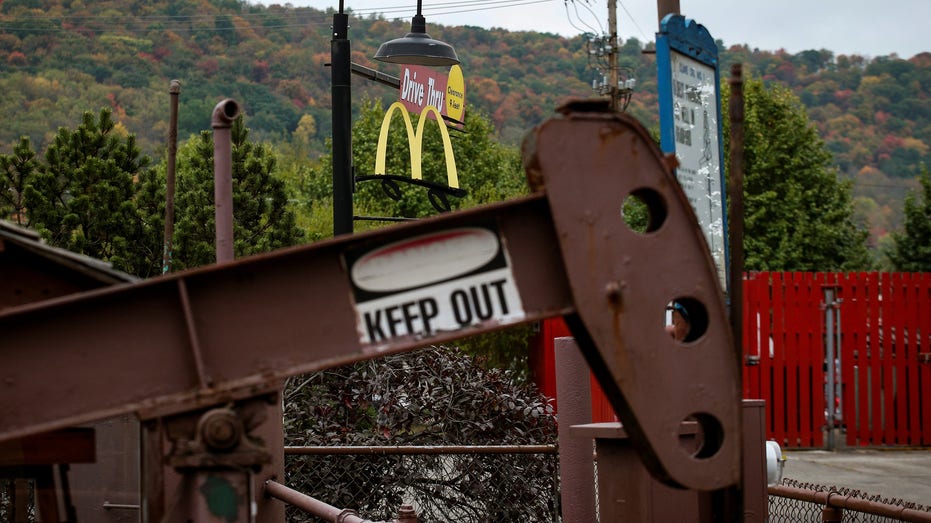 An oil pumpjack operates in the drive-thru area of a McDonald's in Bradford, Pennsylvania