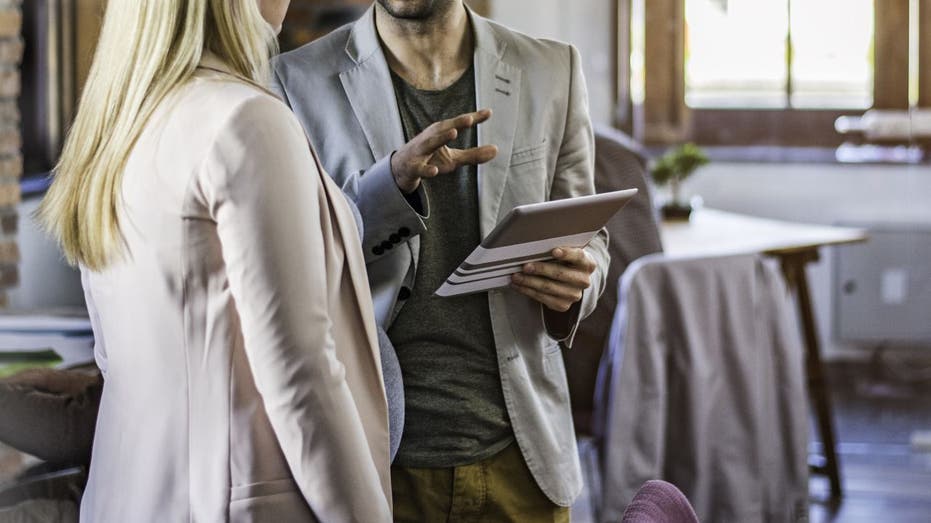 Man speaking to pregnant woman