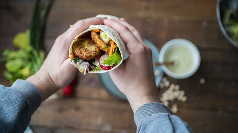 Burrito held in a person's hands