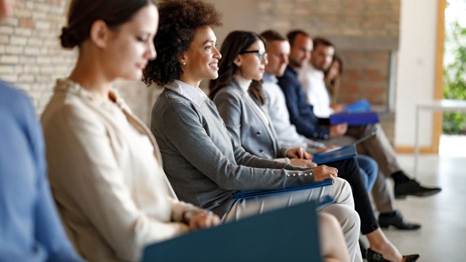 Job candidates sit in a room