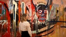 Boutique auctioneer Phillips sold a 16-foot-wide, red-and-peach painting by Jean-Michel Basquiat for $85 million in New York on Wednesday.&nbsp; Japanese billionaire Yusaku Maezawa put the untitled 1982 painting up for sale, and an Asian telephone bidder represented by a Phillips representative based in Taipei won it after a four-minute competition.