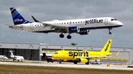 DOJ sues to block $3.8B JetBlue-Spirit Airlines merger, saying it will mean higher fares for customers