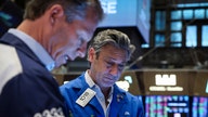 Stocks end lower for day and week amid wild swings