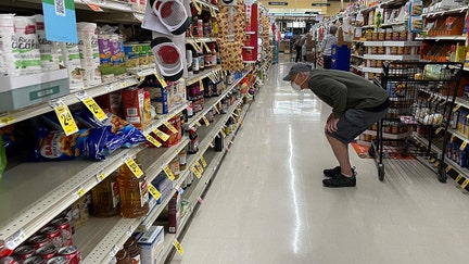 A man shops at a Safeway grocery store in Annapolis, Maryland, on May 16, 2022, as Americans brace for summer sticker shock as inflation continues to grow. (Photo by Jim WATSON / AFP) (Photo by JIM WATSON/AFP via Getty Images)