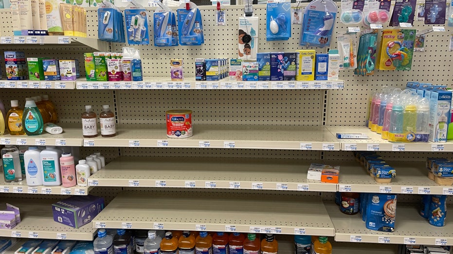 Grocery and pharmacy store shelves empty with baby formula at a premium