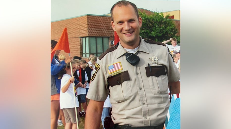 Rian Thiele as a police officer